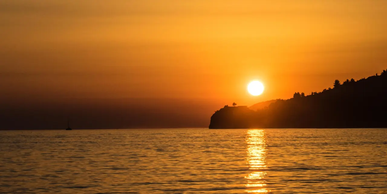 Sunset over the coastline at Himara, southern Albania, seen from above the town