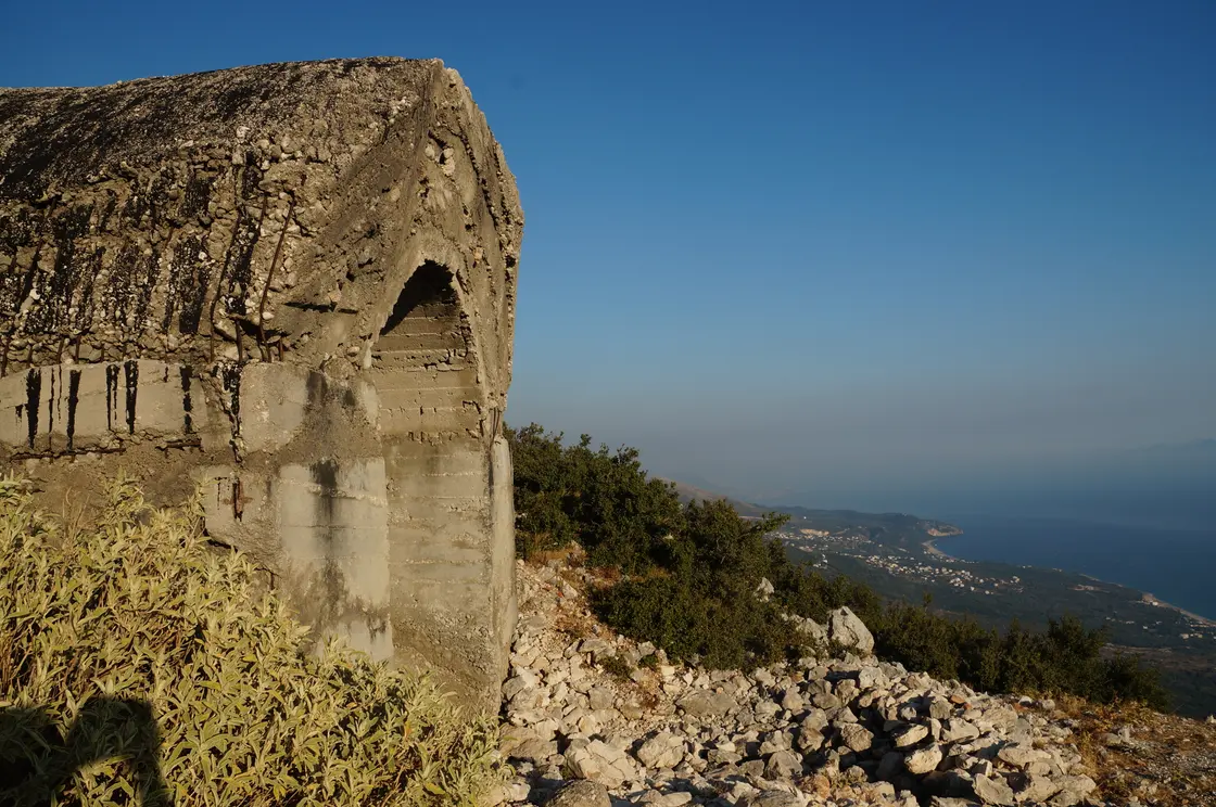 A concrete bunker from a former military post beside the road at Llogara Pass, overlooking the Albanian Riviera