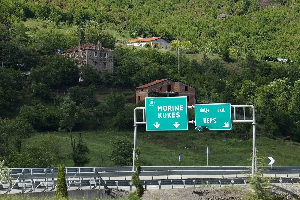 Directional signs on the A1 motorway in northern Albania pointing toward Kukës and the Kosovo border