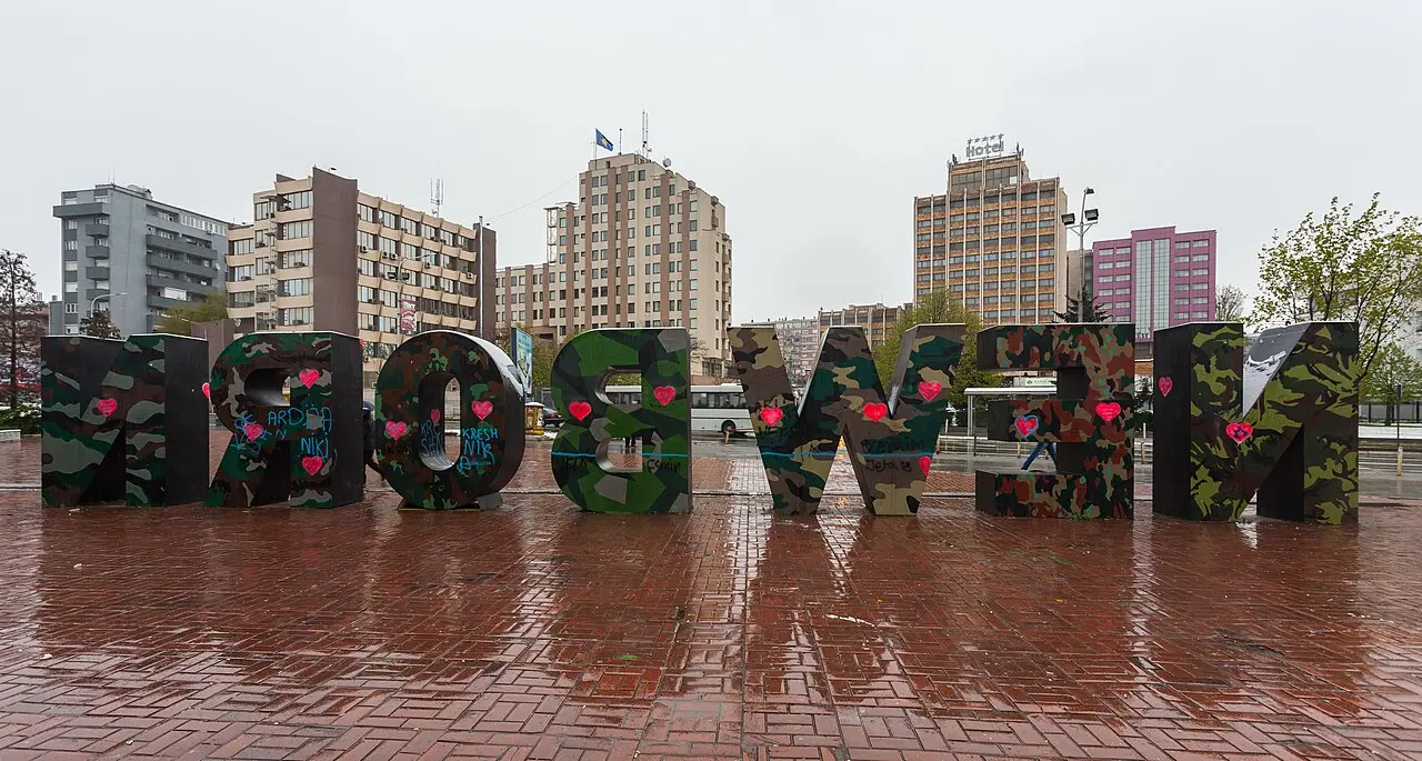 The large NEWBORN letter sculpture painted in camouflage colours in central Pristina
