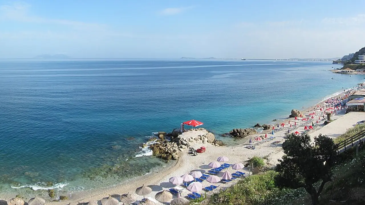 The turquoise bay and pebble beach at Vlora on the southern Adriatic coast of Albania