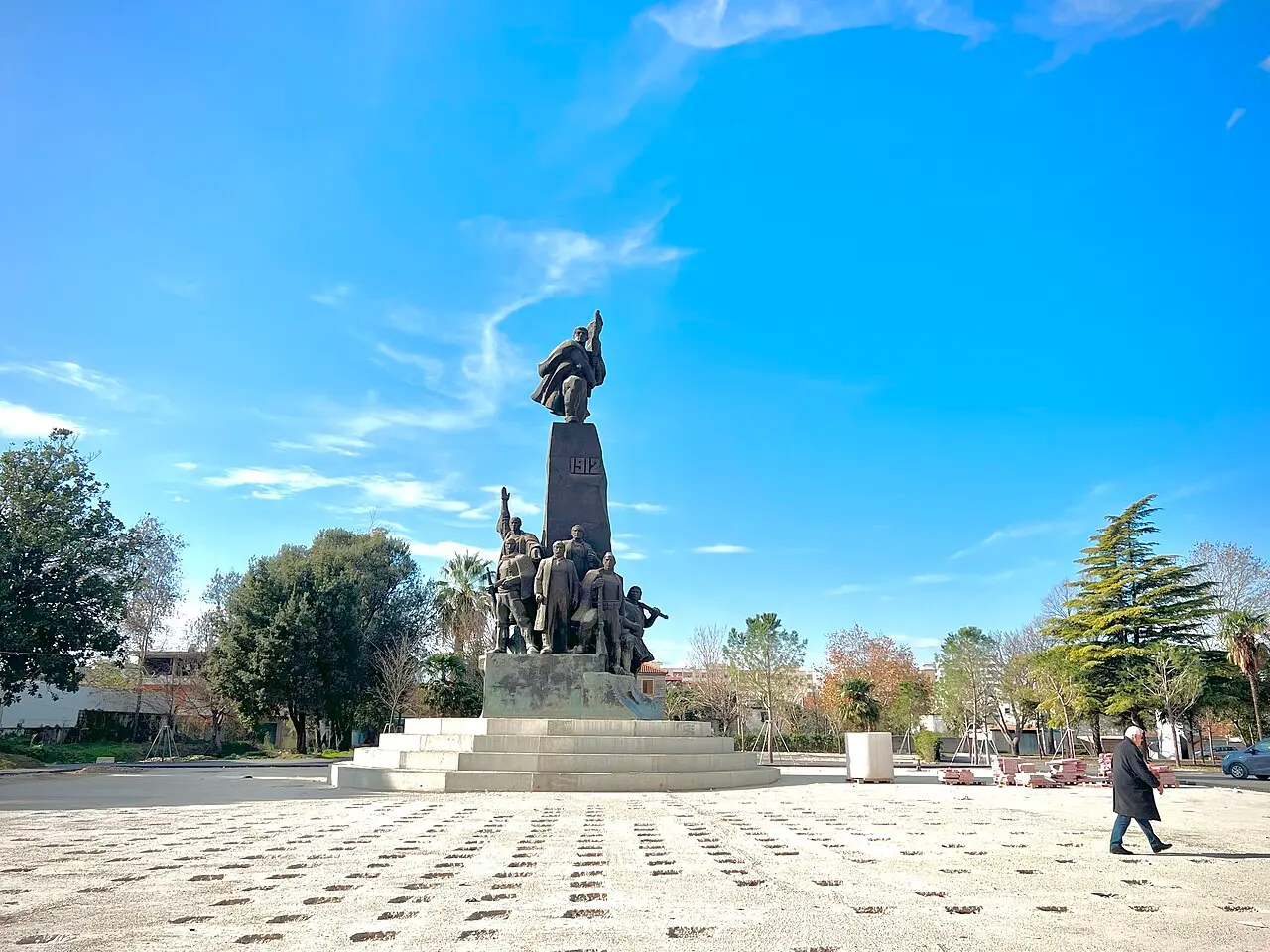 The bronze Independence Monument in Vlora showing the founding fathers around the flag