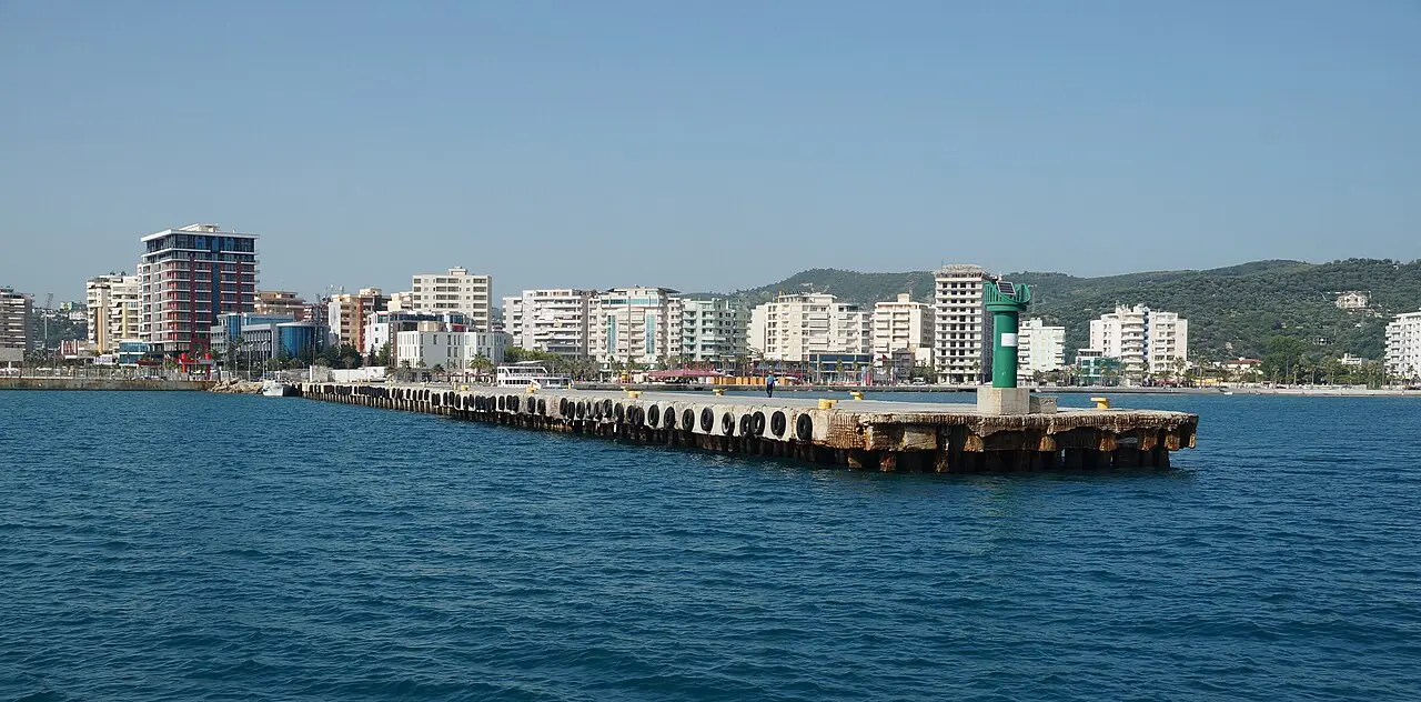 The harbour and waterfront of Vlora curving around its bay