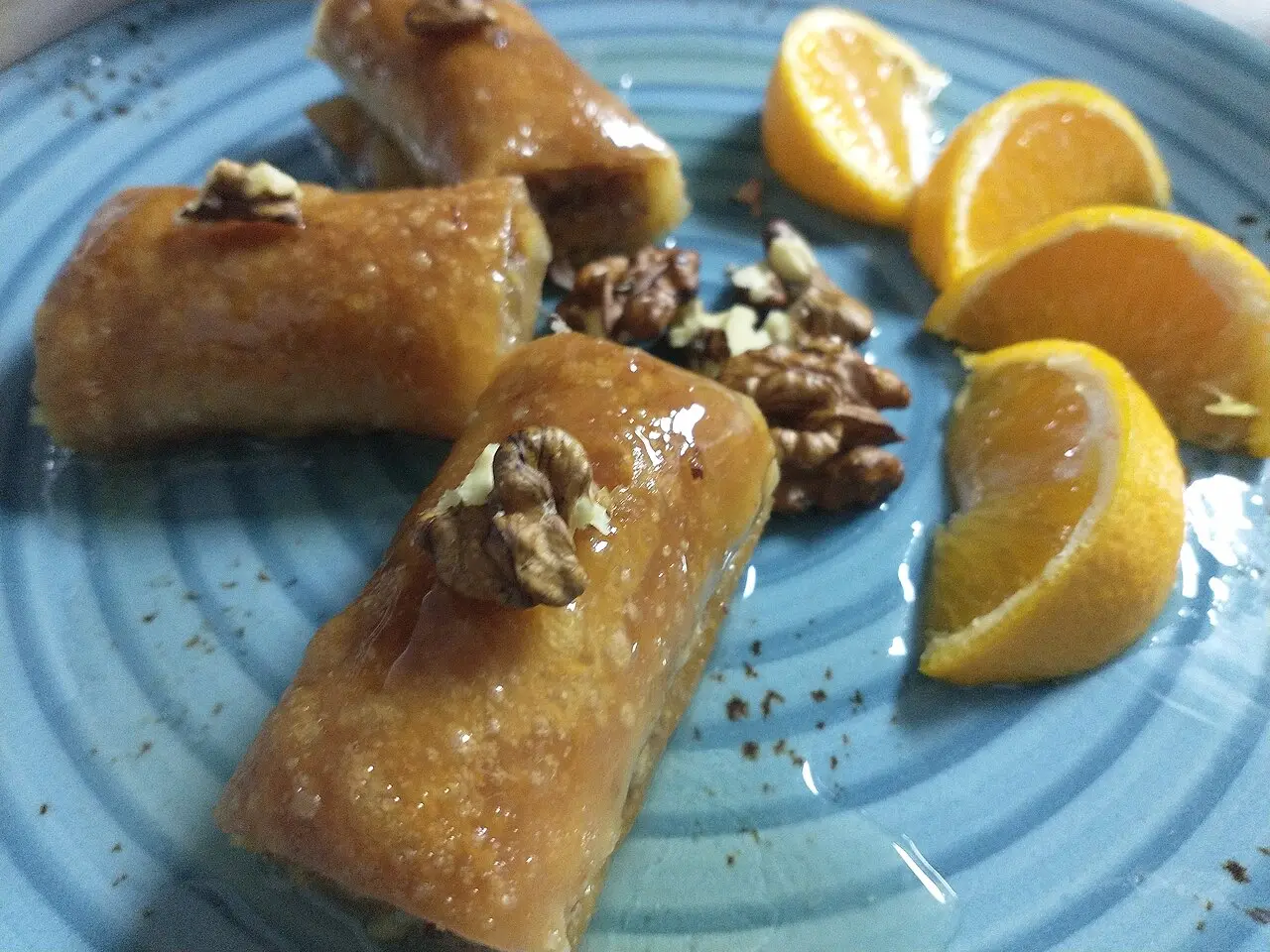 A tray of Albanian baklava, diamond-cut layered pastry with nuts and syrup
