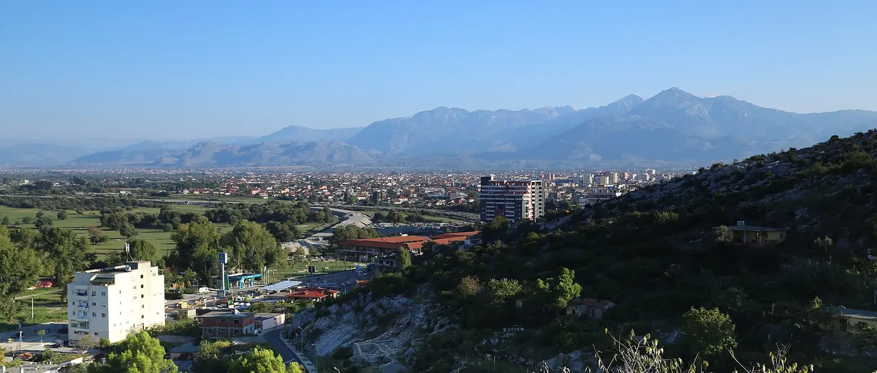 Wide view from Rozafa Castle over the rooftops of Shkodra towards the Albanian Alps